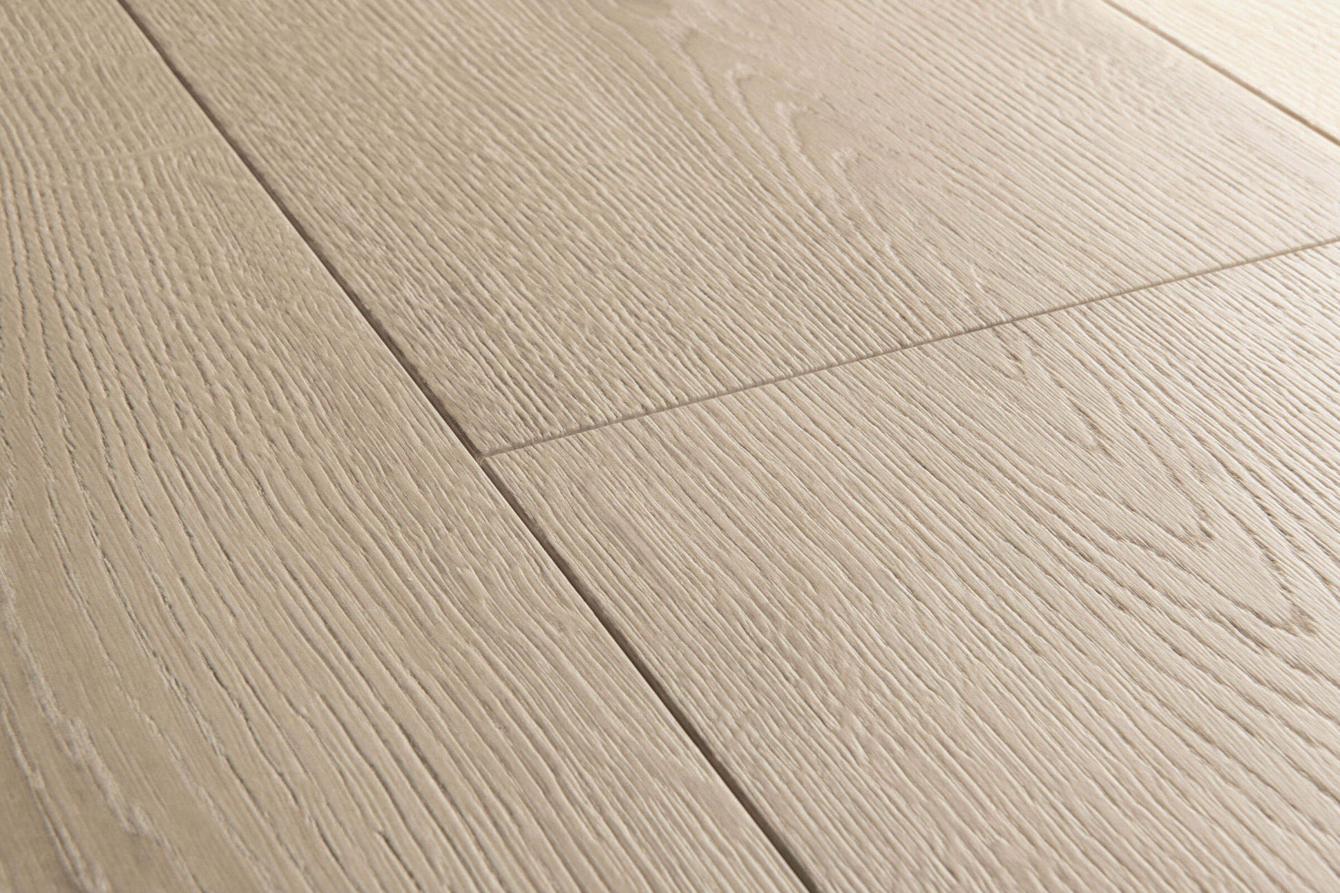 Close-up of a wooden floor with light brown planks.