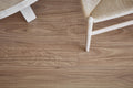 Wooden floor with a chair leg partially visible