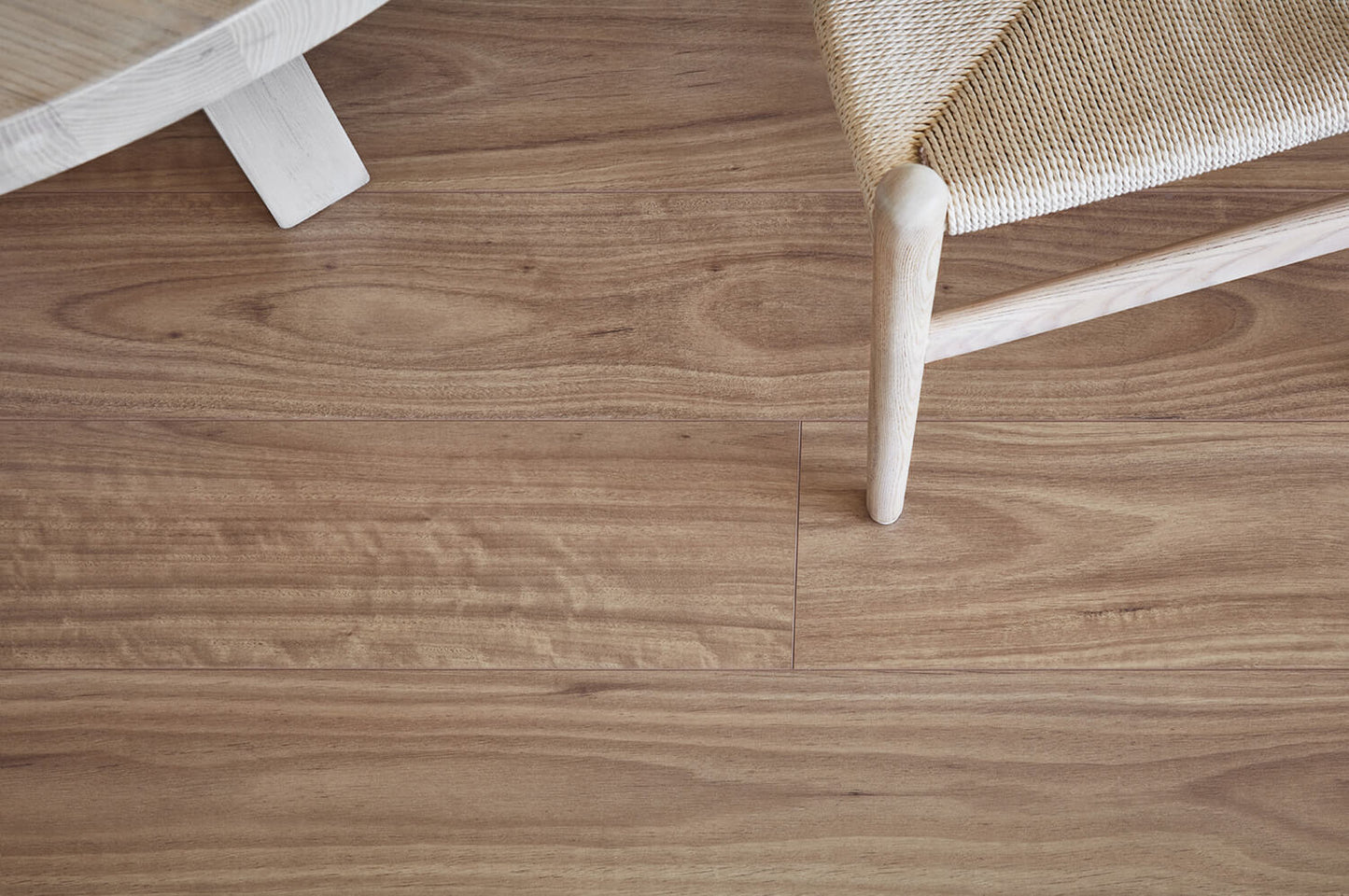 Wooden floor with a chair leg partially visible