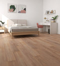 Modern bedroom with wooden floor, bed, desk, and decor