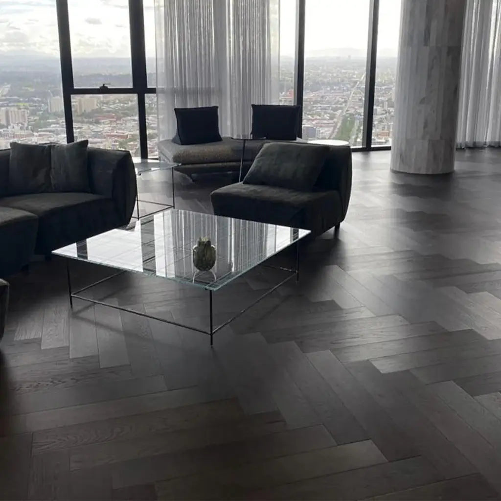 Modern living room with glass coffee table and city view