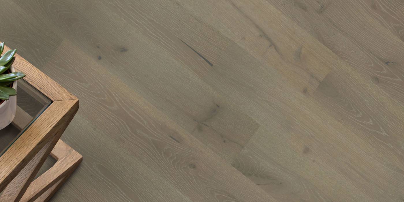 Wooden floor with a wooden table and plant in the foreground