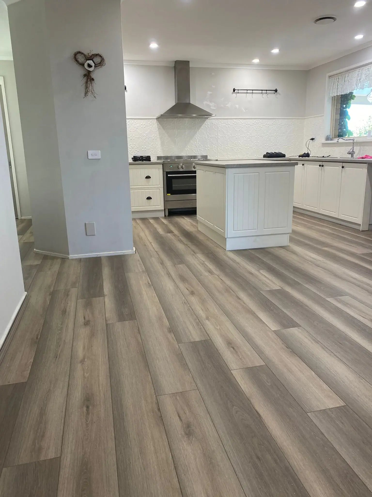 Kitchen with wooden flooring and modern appliances