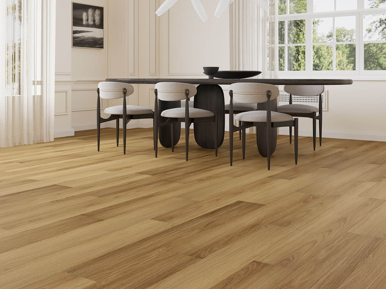 Dining room with wooden flooring, table, and chairs.