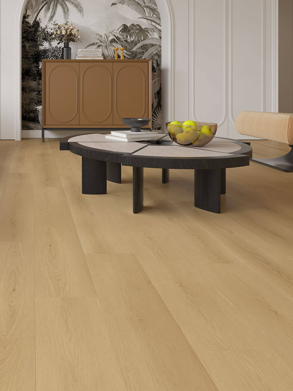 Modern living room with a round coffee table and decorative items.