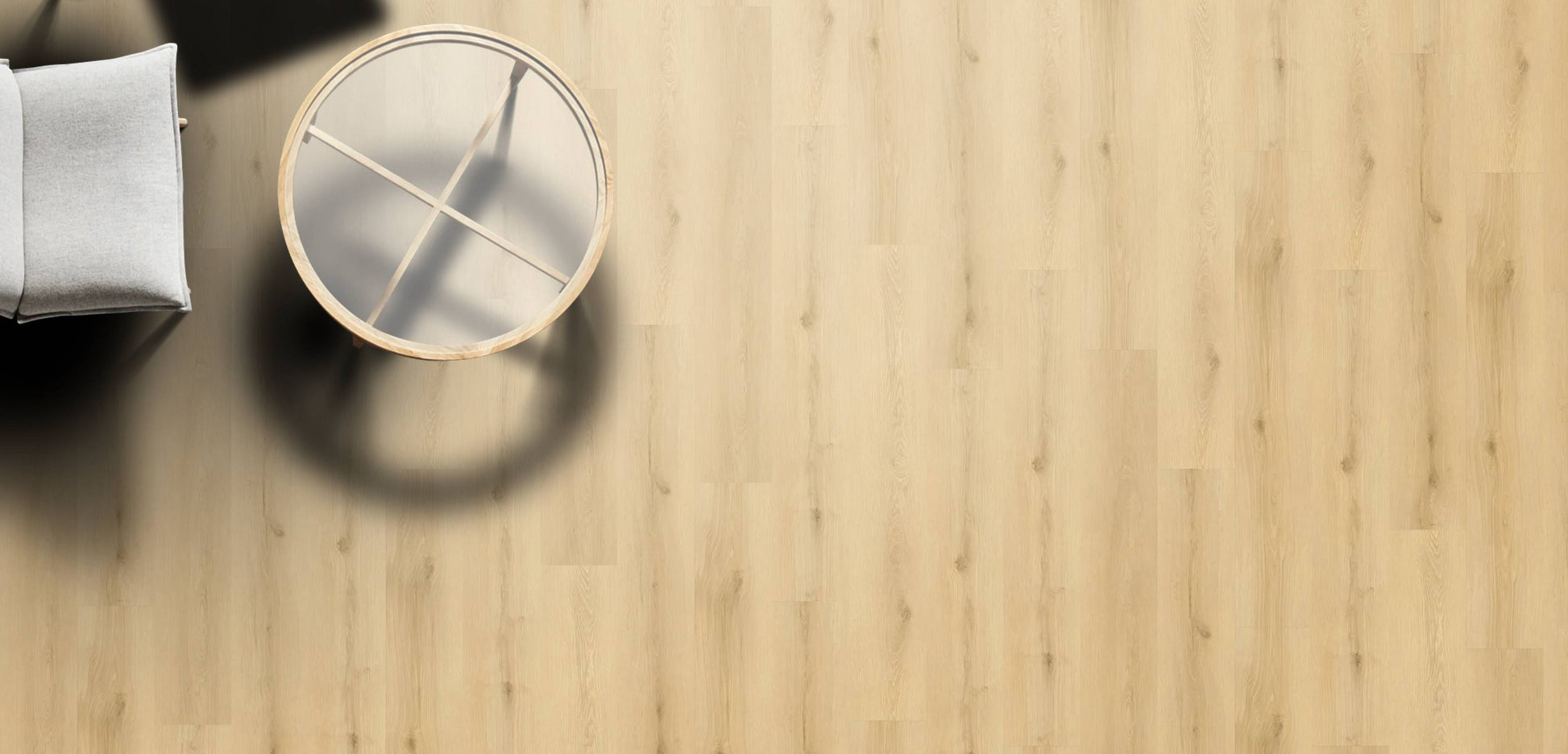 Round glass table on a wooden floor with a neutral color palette