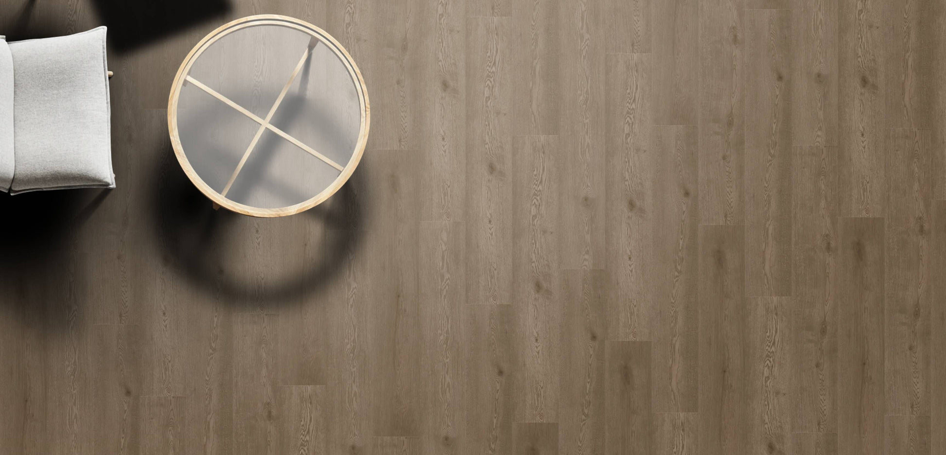 Round wooden table with gold legs on a wooden floor