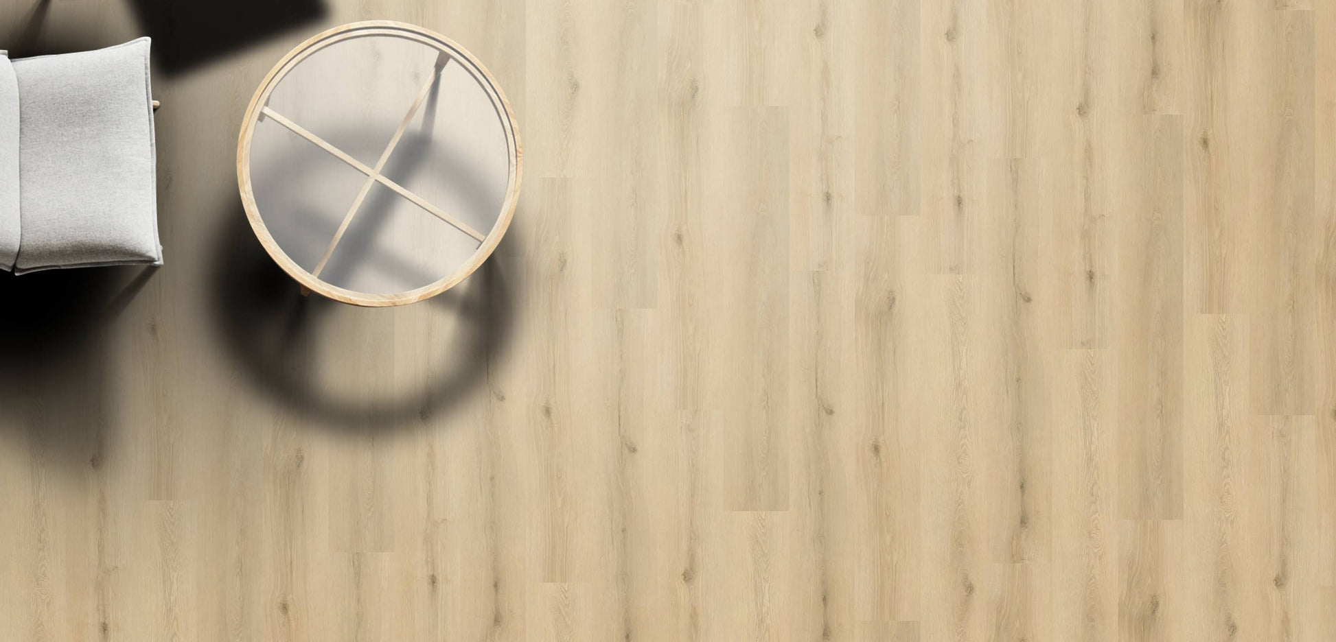 Wooden floor with a round mirror and a cushion on a light wooden surface