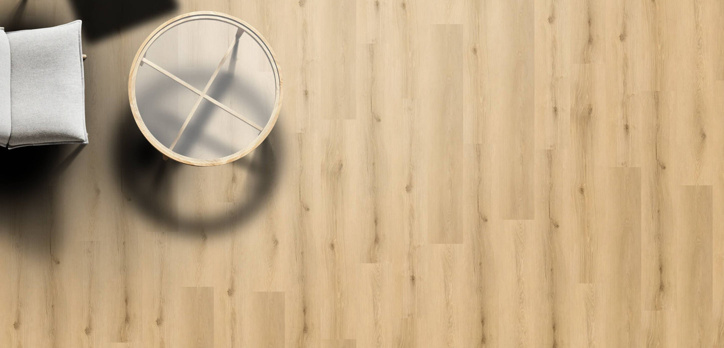 Wooden floor with a round mirror and a white cushion on a chair.