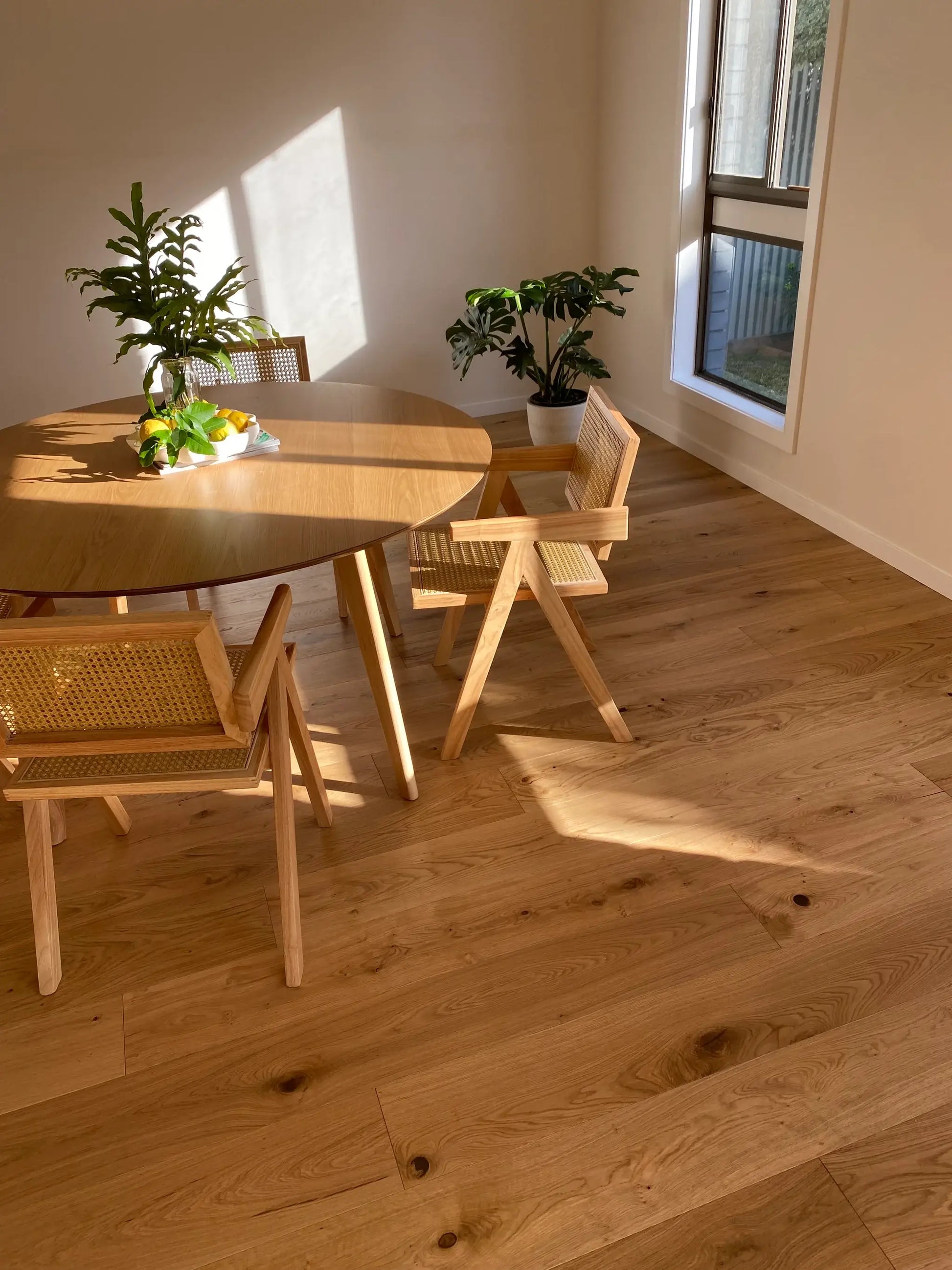Dining area with wooden table and chairs on a wooden floor